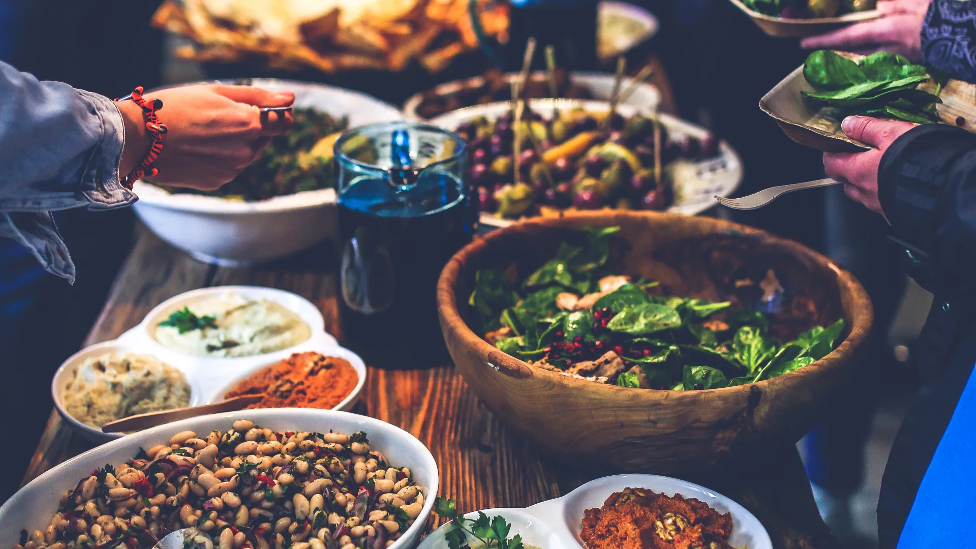 Communal table laden with shared bowls of food